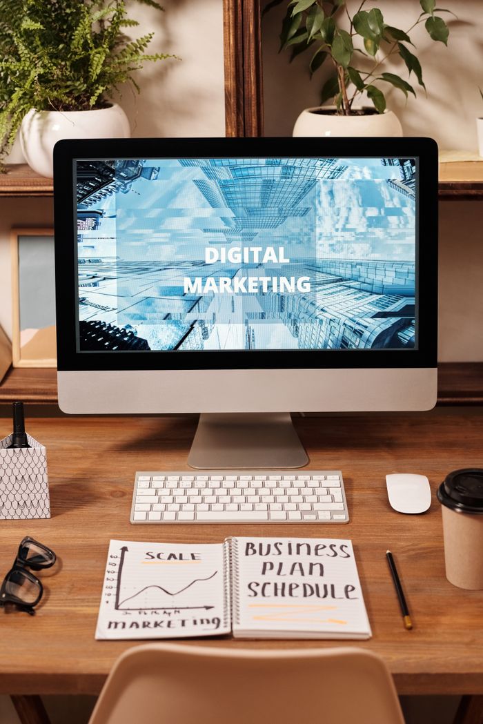 The Art of Drawing Readers In: Your attractive post title goes here Contemporary office setup featuring digital marketing strategy on a computer screen, ideal for business technology themes.